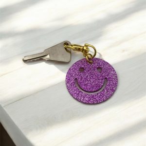 Porte-clés smile violet pailletté